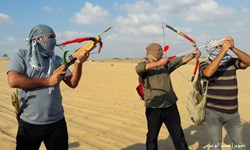 «تیراندازی با کمان» شیوه جدید مبارزه فلسطینیها در راهپیماییهای بازگشت+تصاویر «تیراندازی با کمان» شیوه جدید مبارزه فلسطینیها در راهپیماییهای بازگشت+تصاویر